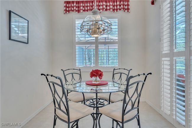 Dining area with plenty of natural light, a chandelier, and baseboards | Image 13