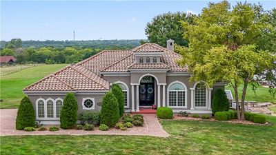 Mediterranean / spanish-style house with a front yard | Image 1