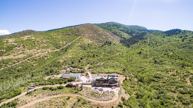 Aerial view featuring a forest view and a mountain view | Image 5