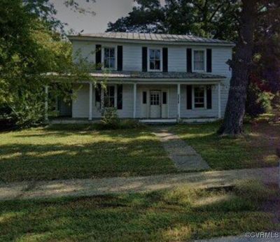 View of front of home featuring a front yard | Image 1