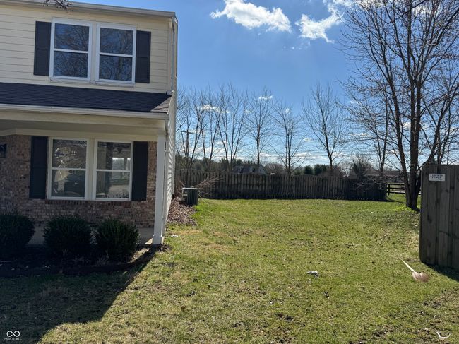 view of side yard with central air condition unit and fence | Image 18