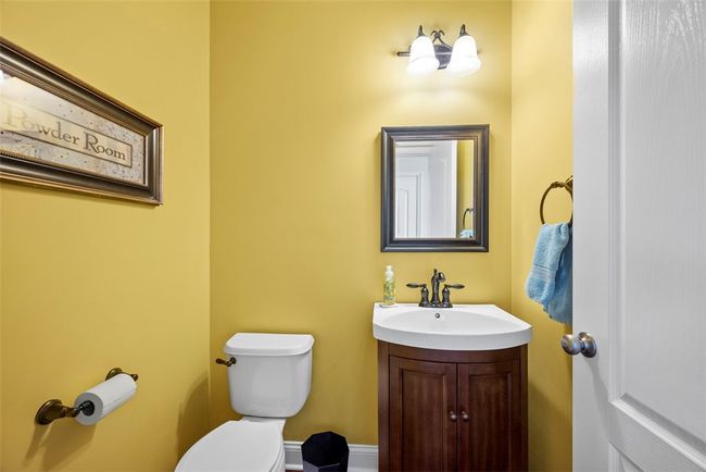 The powder room is conveniently located off of the entry. | Image 22