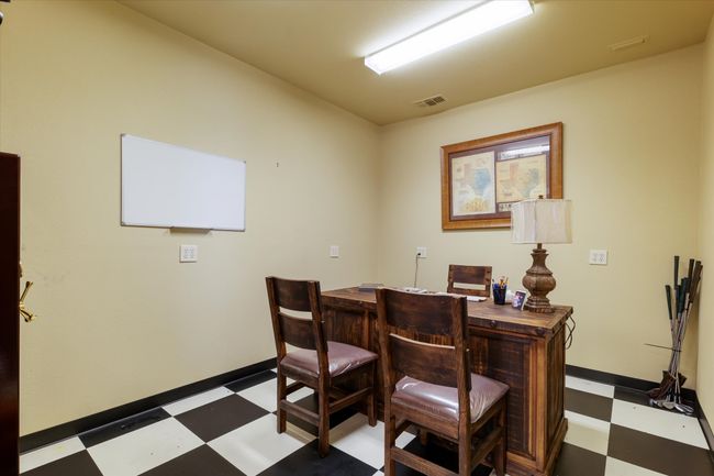 Office space featuring tile patterned floors and baseboards | Image 16