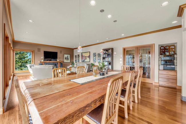 Dining space featuring crown molding, light wood-style floors, french doors, and recessed lighting | Image 22