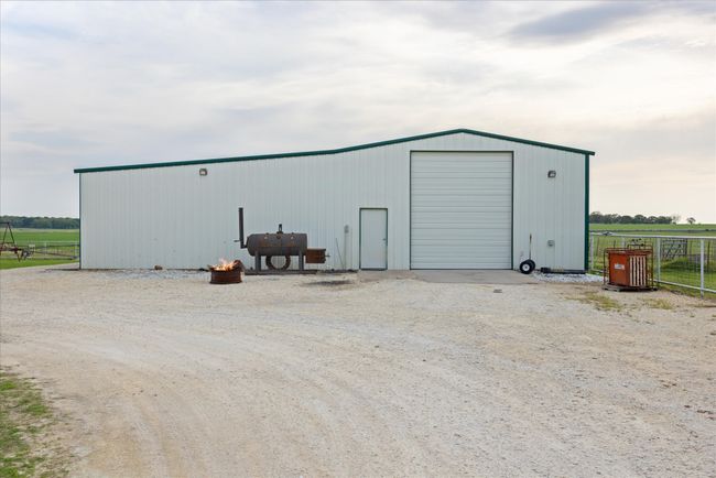 3, 000 square foot shop, insulated, electricity, new LED lights, and carport hangover on south side | Image 27