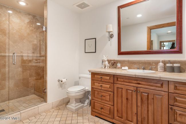 ach bedroom enjoys private bath access, with natural stone finishes, generous storage, and thoughtful details throughout. | Image 18