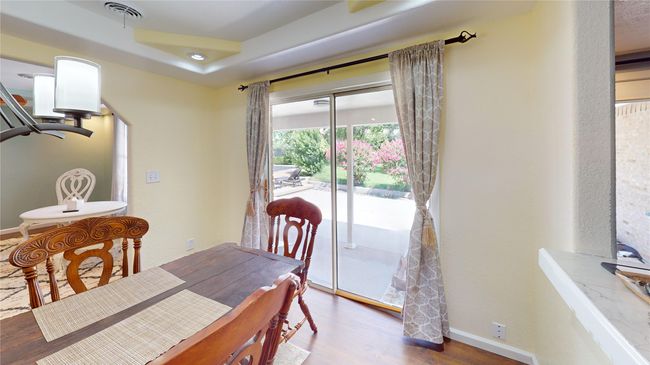 Dining space with wood finished floors and recessed lighting | Image 14