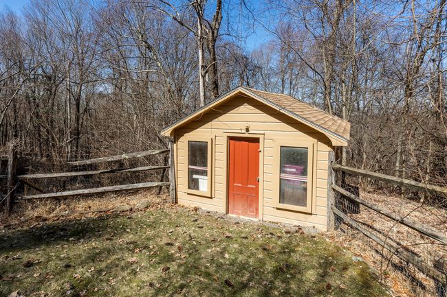 View of outdoor structure featuring an outdoor structure and fence | Image 27