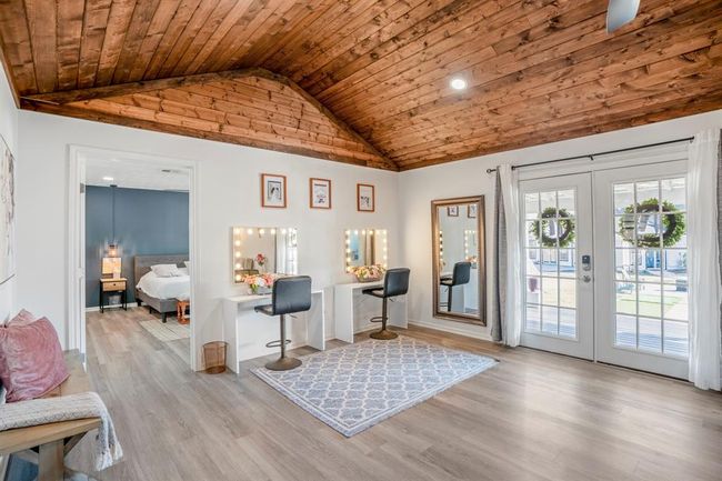 French doors lead to the outdoor spaces, while a flexible area off the living room can easily adapt to your needs. | Image 17