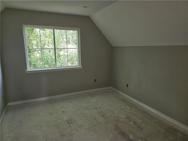 Additional living space with vaulted ceiling and baseboards | Image 11