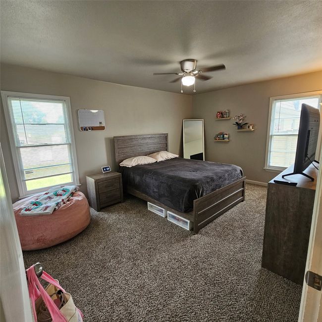 Natural light filled, with plenty of space bedroom. | Image 20