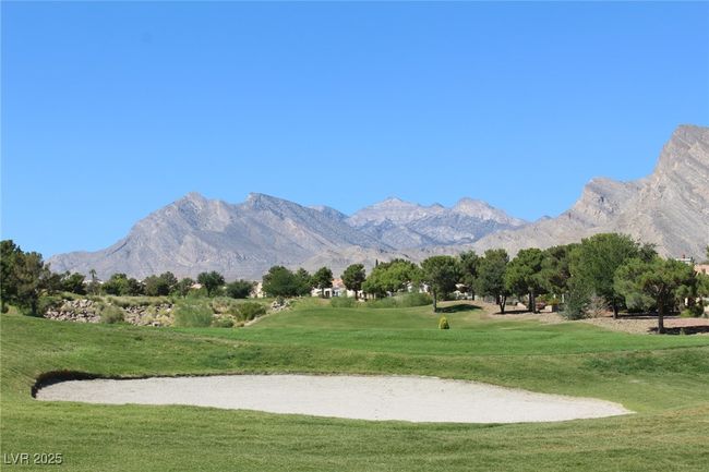 View of home's community with a yard, a mountain view, and view of golf course | Image 26