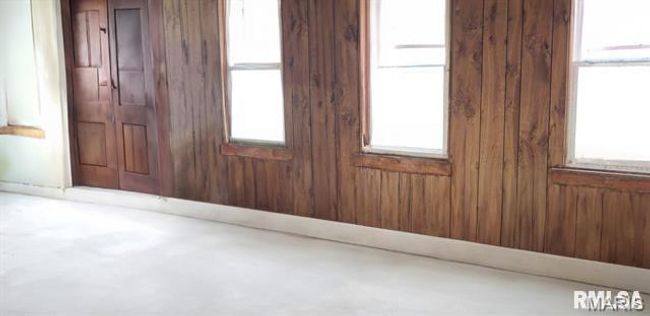 Spare room with wooden walls | Image 7