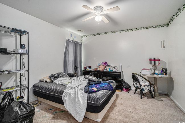 Bedroom featuring baseboards, ceiling fan, and carpet | Image 24