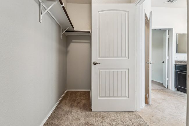 Walk in closet with carpet flooring | Image 25
