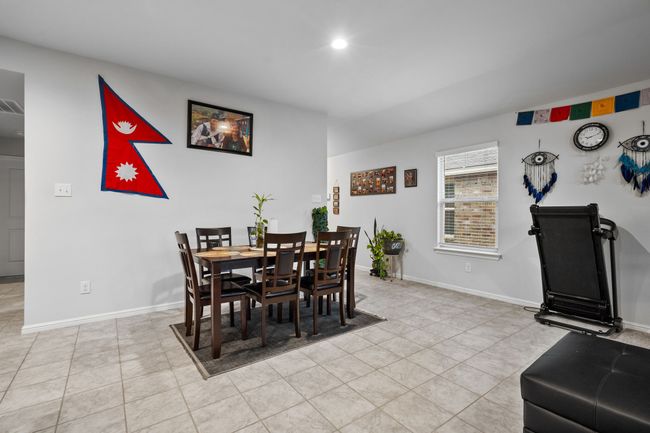 Dining area with baseboards and light tile patterned floors | Image 6