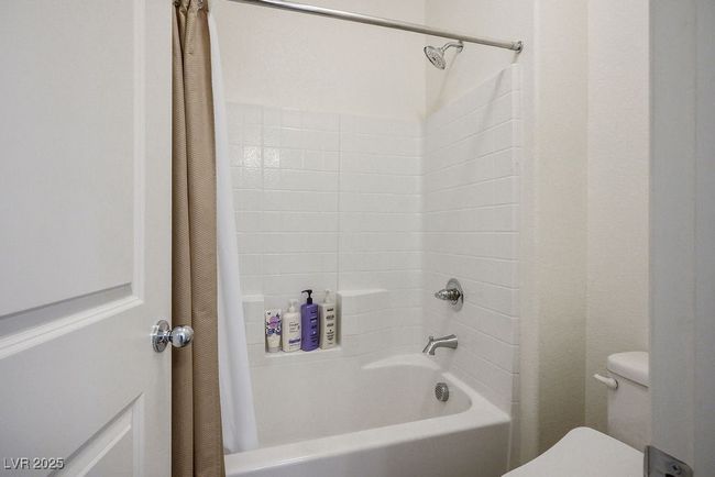 Full bath #3 upstairs featuring shower / bath combination with curtain and toilet | Image 29