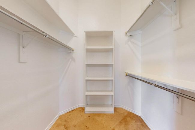 View of walk in closet | Image 25