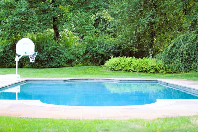 Seasonal view of swimming pool featuring and yard | Image 34