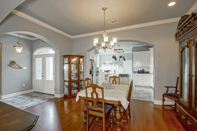 Formal Dining Room has wood flooring. | Image 12