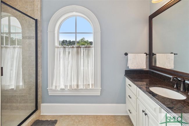 His bathroom has a walk-in shower and a toilet as well. | Image 27