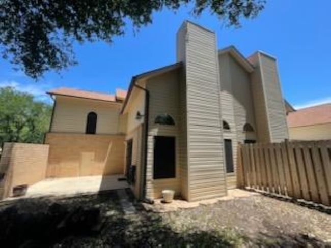Back of house with fence and a chimney | Image 5