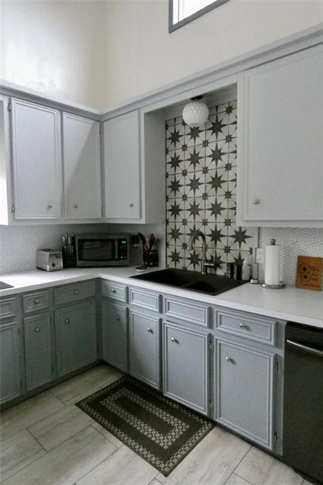 Sink area with decorative tiled backsplash | Image 10