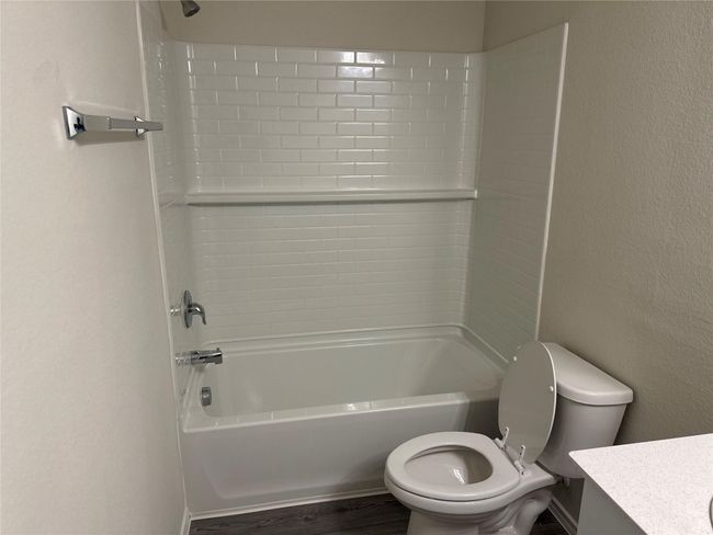 Full bathroom with vanity, bathtub / shower combination, and wood finished floors | Image 15
