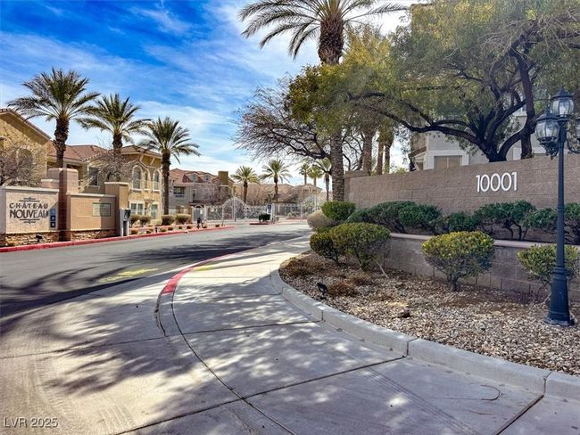 View of street featuring curbs, street lighting, and a residential view | Image 32
