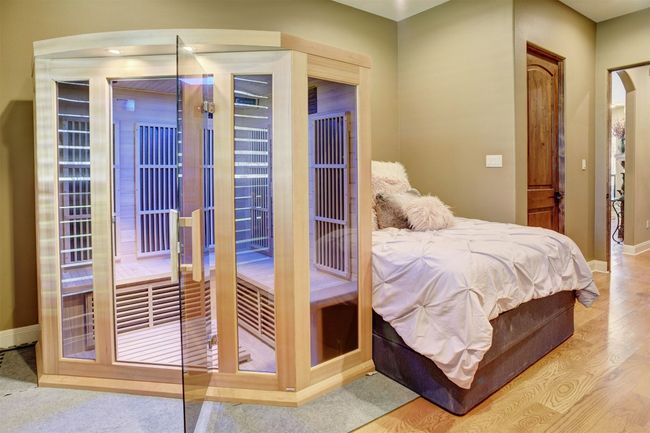 Secondary Bedroom downstairs with private full bathroom. Currently used as a Sauna room but can be a dedicated guest bedroom. | Image 18