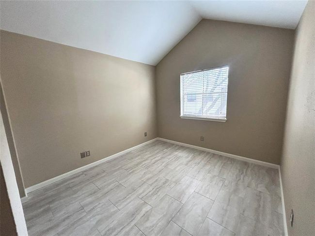 The both bedrooms have vaulted ceilings and spacious closet space and the primary has a private en suite bath. | Image 35