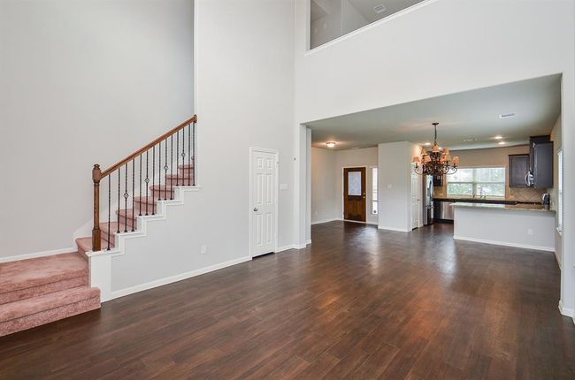 Almost palatial in appearance, with soaring ceiling and clear view upwards, this incredible living/family space is yours to explore and imprint your lifestyle. | Image 9
