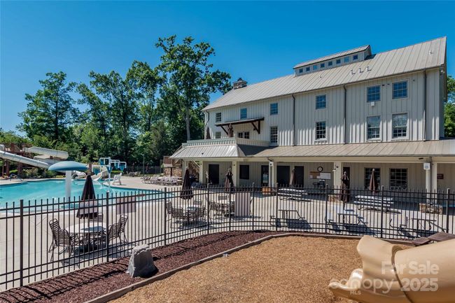 zero entry splash pool with 2 water slides is 1 of 3 pools | Image 45