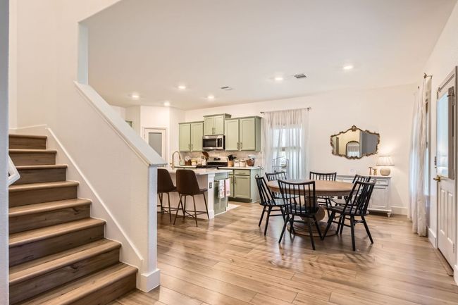 Dining space featuring stairway, light wood-style floors, and recessed lighting | Image 19