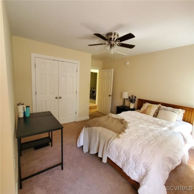 Carpeted bedroom featuring a closet and ceiling fan | Image 41