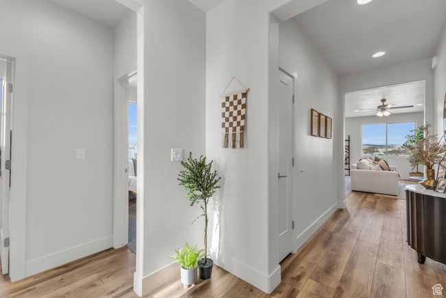 Corridor with light hardwood / wood-style floors | Image 5
