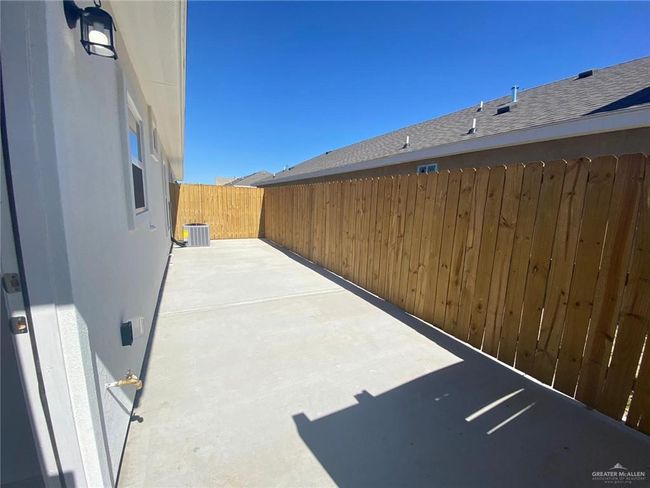 Fenced backyard featuring a patio area | Image 8