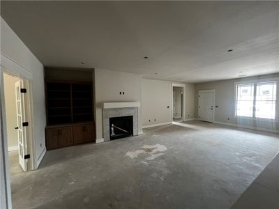 Large living room with built in cabinets and gas log fireplace | Image 2