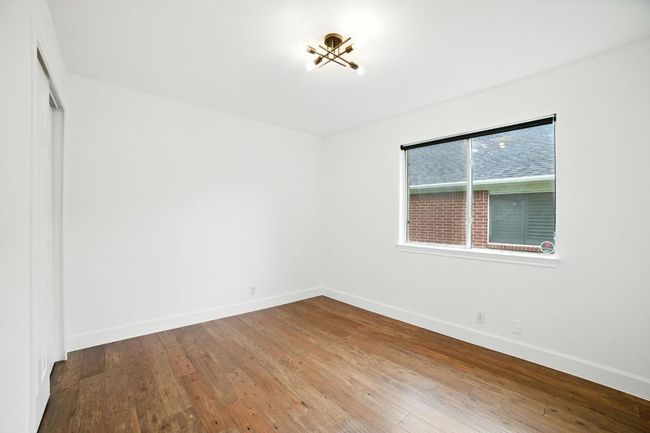 The secondary bedrooms are located at the front of the home, ideal for a guest suite or home office setup. | Image 22