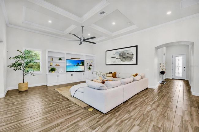 coming in from the hallway it opens to living room, kitchen and dining room | Image 14