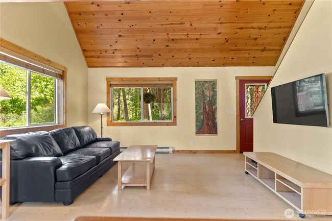 Vaulted wood ceilings with knotty pine trim | Image 16