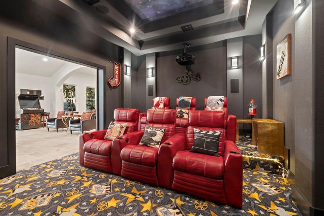 Theater room with starlight ceiling and accent lighting. | Image 22