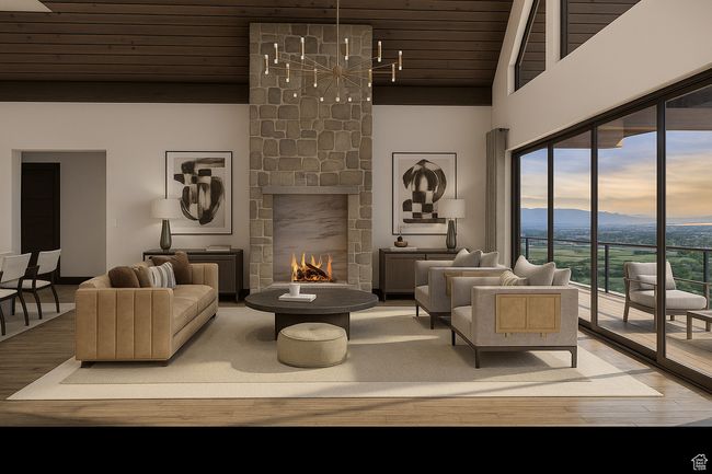 Living area with wood finished floors, a stone fireplace, a chandelier, wooden ceiling, and a towering ceiling | Image 11