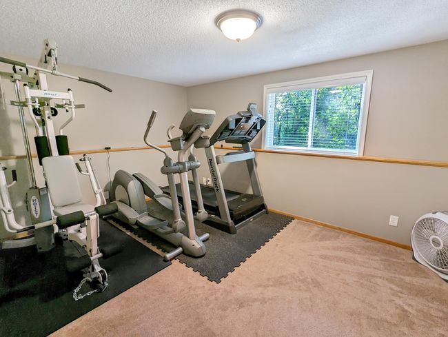 4th bedroom is currently being used as an exercise space. | Image 24