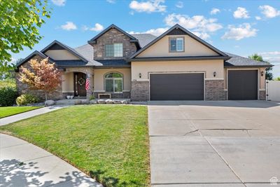 Craftsman-style home with a garage and a front yard | Image 2