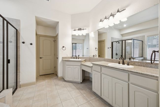 Full bathroom with a stall shower, vanity, healthy amount of natural light, and tile patterned floors | Image 19