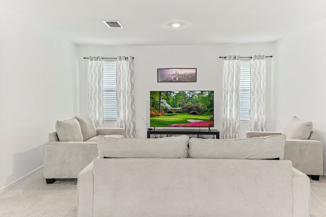 Living room with light colored carpet, plenty of natural light, and recessed lighting | Image 5