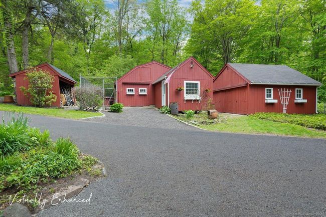 View of barn(s) from second home. Multi use space. | Image 19