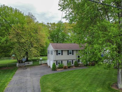 This beauty could be yours; raised ranch set on 2/3 of an acre, with that coveted white picket fence | Image 1