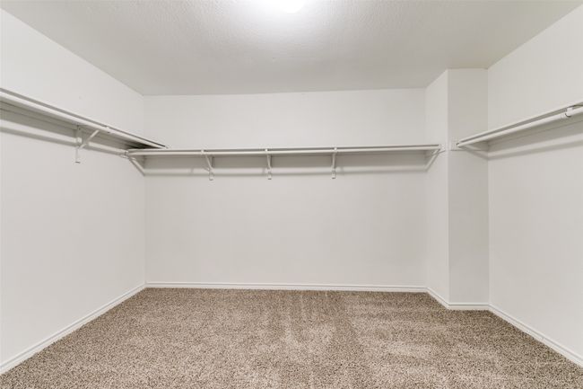 Walk in closet featuring carpet floors | Image 20